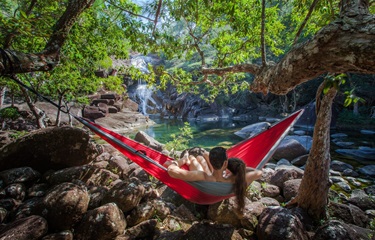 ECD-Hinchinbrook-Way-Hinchinbrook-Island-couple-in-red-hammock-Mulligan-Falls-260618-Landscape-JJ-PTU-scaled.jpg